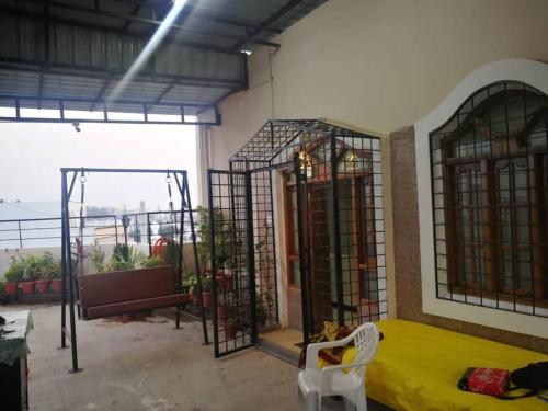 a room with a bed and a view of the ocean at Stylish Penthouse Apartment - ATITHI ESTATE in Hyderabad