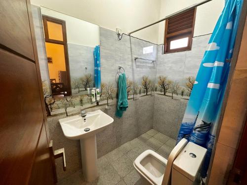 a bathroom with a sink and a shower at Sagya Residencies in Panadura