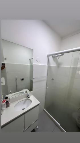 a bathroom with a sink and a mirror at house JV in Rio de Janeiro