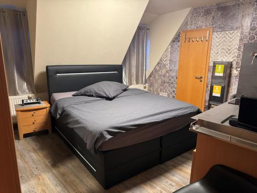 Postel nebo postele na pokoji v ubytování Hotel Mythos "Apartments"