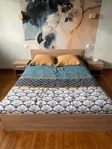 a bed in a room with two nightstands and sidx sidx sidx at maison bretonne 7 personnes in Mellac