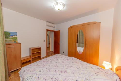 Ένα ή περισσότερα κρεβάτια σε δωμάτιο στο Apartment Qservice Petrovac