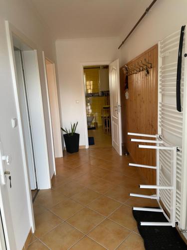a hallway with a tiled floor and a room at Apartmány Potůčky in Potŭčky