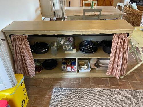 a kitchen island with pots and pans on it at 2 King Bed, 2 Full Bathroom Apartment in Umbria - Tuscany in Città della Pieve
