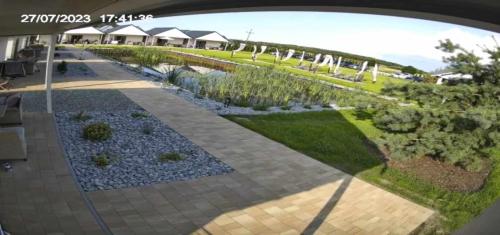 an overhead view of a garden with a walkway at Ośrodek Wypoczynkowy Lawendowo in Jarosławiec