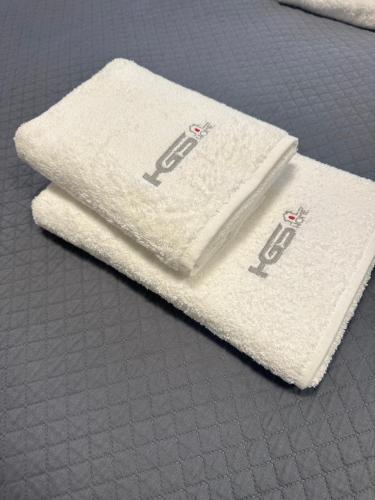 two white towels sitting on top of a table at Apartament Górczyn 14 HGS Home in Gorzów Wielkopolski
