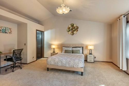 a bedroom with a bed and a desk and a chair at Comfy 4B/2b home near Dunes & Ocean! Pet Friendly! in Florence