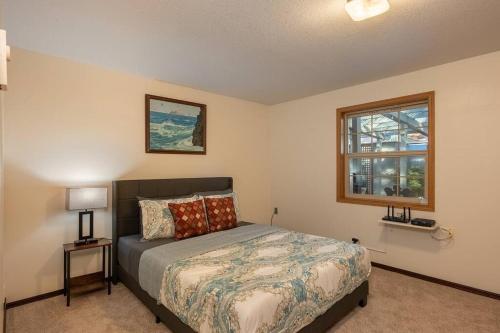 a bedroom with a bed and a window at Comfy 4B/2b home near Dunes & Ocean! Pet Friendly! in Florence