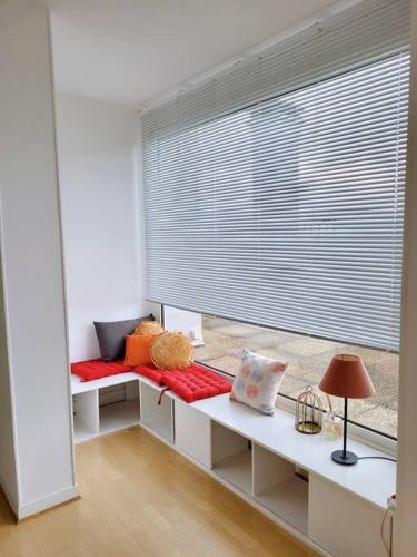 a room with a bed and a large window at Penthouse/ Rooftop Ocean view in Le Havre