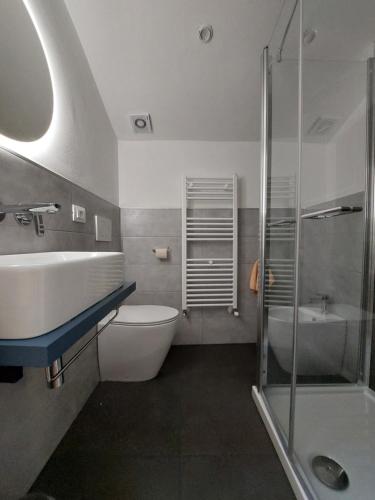 a bathroom with a sink and a toilet and a shower at Casa Delle Volte Perugia in Perugia