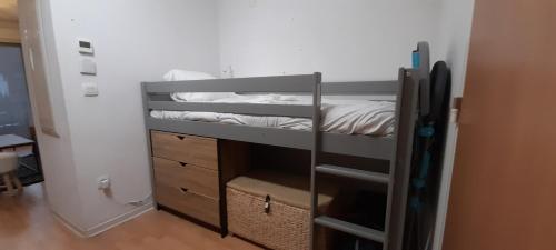 a small room with a bunk bed and a room with a bed at Appartement de l'Isard Bleu, dans résidence de tourisme 3 étoiles in Lourdes