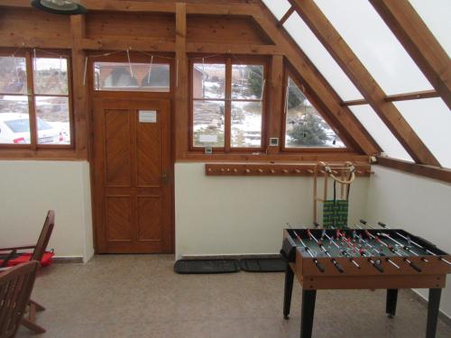 a room with a bunch of wine bottles on a table at Apartmány Yellow in Horní Maršov