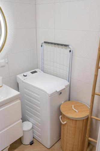 a small bathroom with a toilet and a sink at Pod Kalwarią in Nowosiółki Dydyńskie
