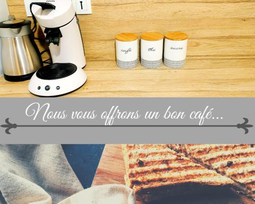 a counter with a coffee maker and some bread at Escapade au cœur de Luce chartres in Luce