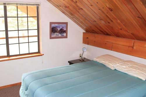Postel nebo postele na pokoji v ubytování Bear Paw Lodge & Vacation Homes