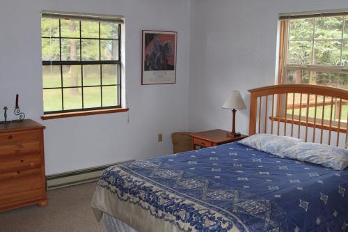 Postel nebo postele na pokoji v ubytování Bear Paw Lodge & Vacation Homes