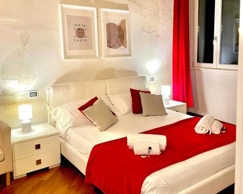 Posteľ alebo postele v izbe v ubytovaní Magnolia Home - Piazza delle Erbe