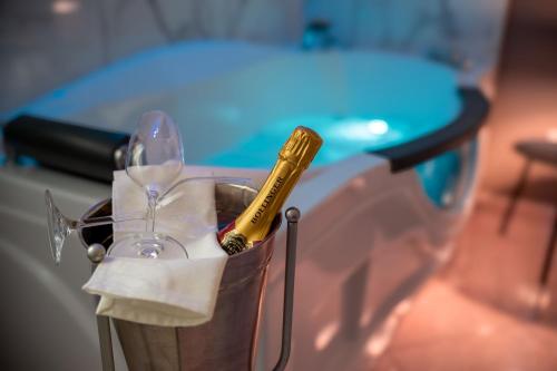 a champagne bottle is sitting in a trash can at la porta di Alba in Palermo