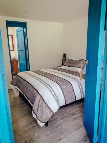 Una cama o camas en una habitación de Hacienda Tocarema