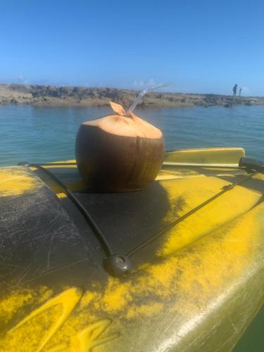 a close up of the front of a boat on the water at Ekoara Residence in Porto De Galinhas