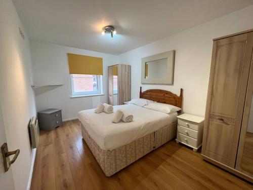 a bedroom with a bed with two pillows on it at Quayside City Escape - Liverpool in Liverpool