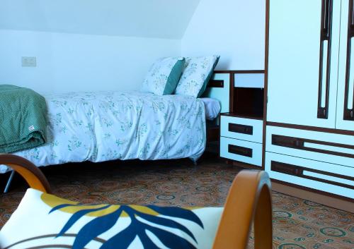 a bedroom with a bed and a dresser at Villa Anna in San Venanzo
