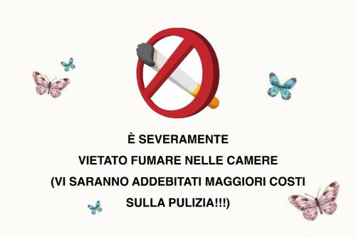 a group of butterflies and a sign with a no symbol at Serenity House di Valeria Favara in Scordia