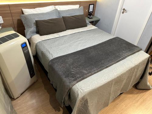 En eller flere senge i et værelse på Studio Paris prox Metro Bras Feirinha Madrugada Templo Salomão