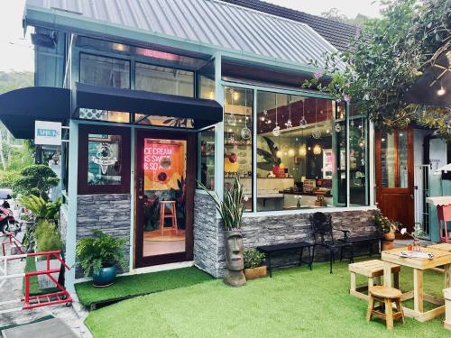 a restaurant with a table and chairs in front of it at 103/24 Kathu Waterfall in Phuket Town