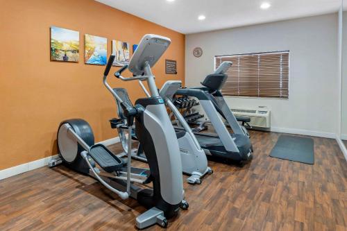 a gym with two exercise bikes in a room at Comfort Suites Normal University area in Bloomington