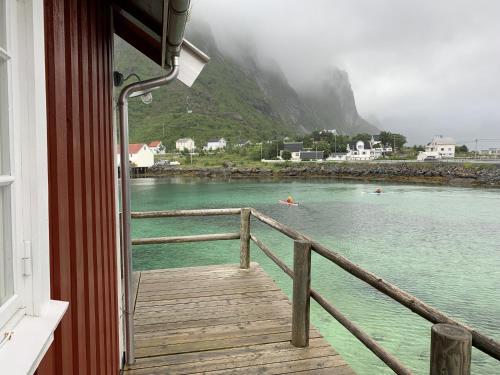 a view of the water from a balcony of a boat at Valen Cabins in Reine in Reine