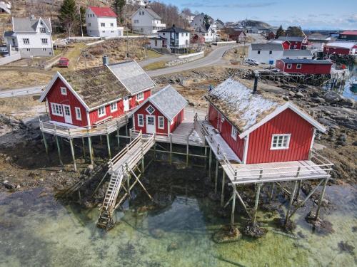 an aerial view of a village with red houses at Valen Cabins in Reine in Reine