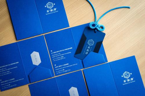 a bunch of blue brochures on a table at 禾淞津別邸 Kashotsu Bettei in Taichung