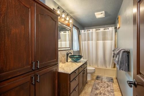 a bathroom with a sink and a toilet at Comfy 4B/2b home near Dunes & Ocean! Pet Friendly! in Florence
