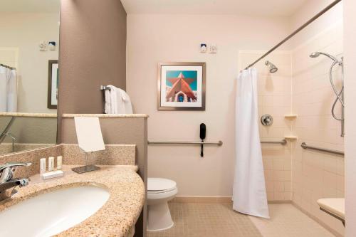 a bathroom with a sink and a toilet and a shower at Courtyard by Marriott San Antonio North Stone Oak At Legacy in San Antonio