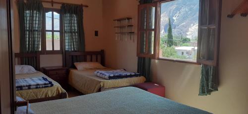 Postel nebo postele na pokoji v ubytování Maimará Jujuy