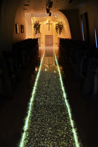 an aisle in a church with lights on it at Kushiro Century Castle Hotel in Kushiro