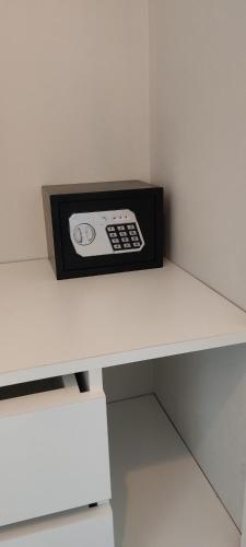 a microwave sitting on top of a white counter at Movistar Arena "Rincón de ensueño" Palermo in Buenos Aires