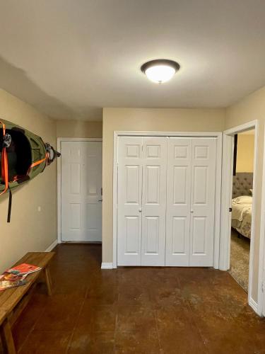 a room with a white garage door and a bedroom at Bayou and Beyond: The perfect stay in Monroe