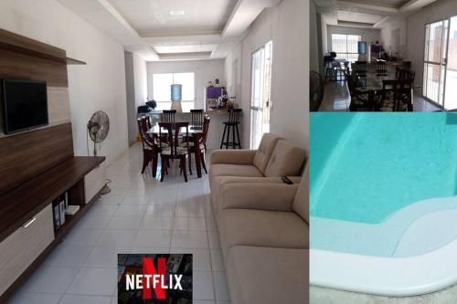 a living room with a couch and a dining room at Casa com piscina em Itamaracá in Itamaracá