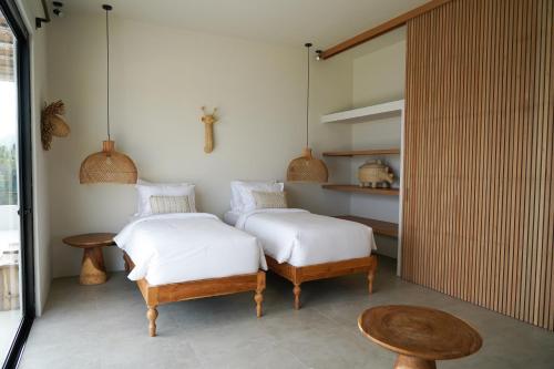 Postel nebo postele na pokoji v ubytování Cliffside Haven in Nusa Penida