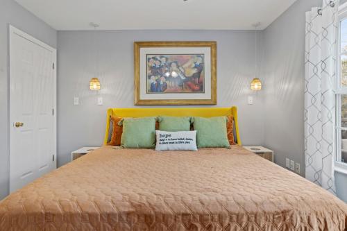 a bedroom with a bed with a pillow on it at Waterfront Home with Pool, Hot Tub and Game Area in Shoreline Park