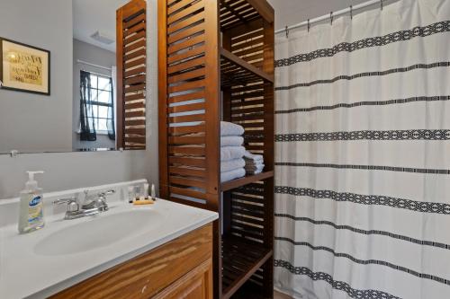 a bathroom with a sink and a shower at Waterfront Home with Pool, Hot Tub and Game Area in Shoreline Park