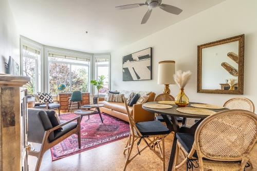 a living room with a couch and a table at Seattle Among The Trees: in Belltown w/Parking! in Seattle
