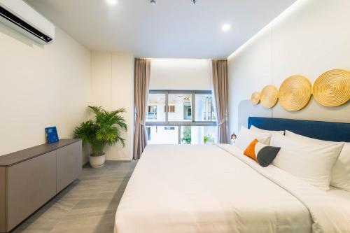 Katil atau katil-katil dalam bilik di HOMA Cherngtalay Phuket