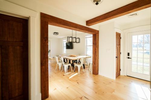 a dining room with a table and chairs at Charming Farmhouse near Bird in Hand in Lancaster