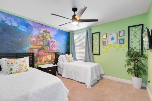 a bedroom with two beds and a painting on the wall at *Roseville Disney Villa Pool+BBQ+King Bed+Parks* in Kissimmee