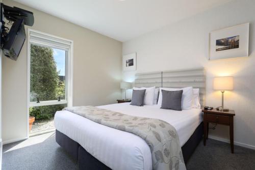 Säng eller sängar i ett rum på Chelsea Park Motor Lodge