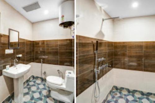 uma casa de banho com um lavatório, um WC e um chuveiro em Hotel Green Embassy Meerut em Meerut