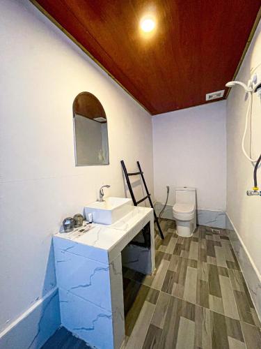 a bathroom with a sink and a toilet at CORAL in Koh Rong Sanloem